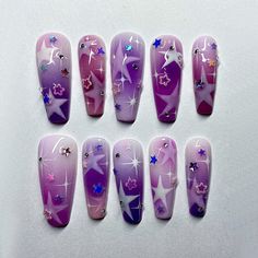 Step into the cosmos with this enchanting Purple Galaxy Star Press-On Nail Set. Featuring a dreamy ombre design with glittering stars, moons, and rhinestone accents, this set is perfect for those who adore celestial beauty. Whether for a special occasion or everyday glamour, these nails bring a touch of the universe to your fingertips. Key Features and Highlights: Purple Ombre Base: A stunning gradient from soft lilac to deep purple creates a dreamy and magical backdrop for the design. Star and Moon Patterns: Hand-painted white stars and crescent moons add a celestial and ethereal vibe, making each nail a tiny piece of the night sky. Holographic Star Sequins: Iridescent star-shaped sequins in vibrant colors like blue, pink, and silver add a playful sparkle and dimension. Rhinestone Accents Twilight Nails, Purple Ombre Nails, Fake Nails Designs, Pretty Gel Nails, Really Cute Nails, Kawaii Nails, January 29, Star Nails, Birthday Nails