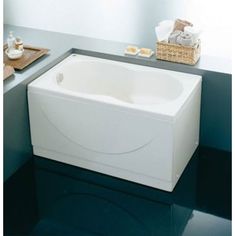 a white bath tub sitting on top of a counter