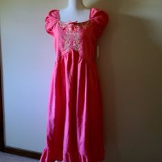 Nwt - A Charming And Beautiful Peach Dress That's Both Flowy And Comfortable, Featuring Detailed Embroidery On The Front Bodice, Smocking On The Back, Elasticized Cap Sleeves, An Inner Lining, And A Ruffled Hem. 1. Medium - Armpit To Armpit- 18 Inches, Length 38 Inches (Peach Color) 2. Large-- Armpit To Armpit 19.5 Inches, Length 38 Inches(Peach Color) Pink Cotton Holiday Dress, Pink Sundress For Holiday, Pink Holiday Sundress, Detailed Embroidery, Peach Dress, Peach Color, Color 2, Embroidered Dress, Kids' Dresses