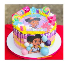 a birthday cake decorated with an image of dora the explorer on top and balloons around it