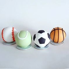 three cakes decorated with different types of sports balls