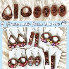 several different wooden earrings are shown in this ad