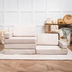 a white couch sitting on top of a wooden floor