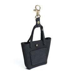 All Color: Shadow Black | tiny tote purse keychain with lobster clasp and front pocket Earbud Case, Leather Tote Purse, Mens Leather Bag, Leather Bag Women, Accessory Pouch, Tote Purse, Leather Care, Leather Goods, Fun Bags