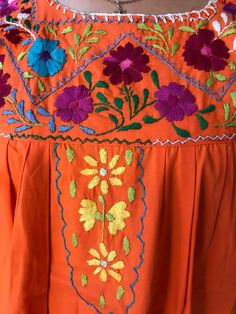 Beautiful Mexican dress, vintage 90's. Made of Cotton, hand-embroidered flowers. Ideal for a mexican party, mexican wedding, beach dress, resort wear, spring, summer, etc. Loose fit Fits size Small Perfect conditions. Orange Cotton Dress For Festivals, Spring Orange Tunic Maxi Dress, Orange Tunic Maxi Dress For Spring, Orange Bohemian Maxi Dress With Short Sleeves, Summer Cotton Maxi Dress With Multicolor Embroidery, Multicolor Embroidered Cotton Maxi Dress For Summer, Bohemian Short Sleeve Dresses For Festivals, Spring Hippie Orange Dresses, Orange Embroidered Festival Dress