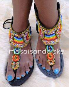 100% handmade using leather and fine beads. Masai beaded sandals are made using the pure original leather and quality African beads.They are inspired by the Masai community They are perfect for any occasion. True to size. We ship worldwide. Feel free to send me a convo for any clarifications Round Toe Sandals For Party Festivals, Festival Round Toe Sandals For Parties, Festival Party Sandals With Round Toe, Embellished Toe Post Festival Sandals, Embellished Toe Post Sandals For Festival, Bohemian Embellished Sandals For Summer, Summer Bohemian Embellished Sandals, Beaded Toe Loop Sandals For Summer, Beaded Ankle Strap Sandals For Summer