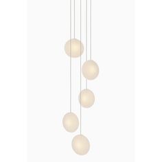 five light chandelier with white glass balls hanging from the ceiling