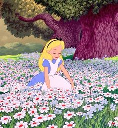 the princess sits in a field full of daisies