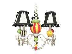 a chandelier with two lamps hanging from it's sides and some balls on the bottom