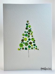 a card with a green christmas tree on it