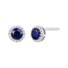 These diamond and blue sapphire stud earrings feature two coveted round stones emboldened by shimmering diamond halos in 14K white gold. Accessorize with their enduring color, ageless style and meaningful glamour. | Diamond & Blue Sapphire Stud Earrings | 14K White Gold | Helzberg Diamonds Blue Sapphire Studs, Sapphire Stud Earrings, Sapphire Earrings Studs, Helzberg Diamonds, Diamond Birthstone, Luxe Jewelry, Sapphire Studs, Ageless Style, Monogram Jewelry