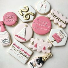 decorated cookies are arranged in the shape of birthday hats, champagne bottles and other items