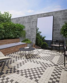 an outdoor seating area with checkered tile flooring and potted plants on the wall