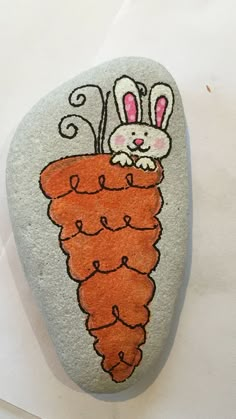 a rock painted with an image of a carrot