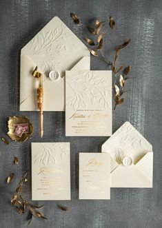 the wedding stationery is laid out and ready to be put into their guests'envelopes