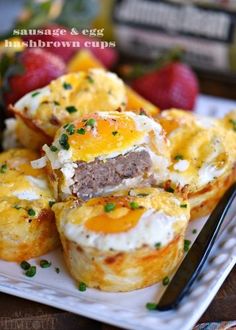 sausage and egg muffins on a plate with strawberries