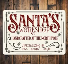 a sign that says santa's workshop handcrafted at the north pole spectacularly in toys, candy, and magic