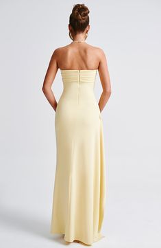 Be obsessed with Zafira, our timeless maxi made in luxury stretch crepe that moulds to your body for a heavenly fit. With a strapless neckline and pleated detailing, this showstopping look has a thigh high split and drape to one side. 



Colour: Lemon.

Premium stretch crepe fabric.

Fully lined.

Strapless.

Pleated panel on bust.

Asymmetric pleats on waist.

Moulds to body figure.

Thigh high split.

Drape detail.

Invisible zipper to the reverse.

Maxi length.

Model is an XS and is wearing an XS.

 Size: XS, S, M, L, XL, XXL Split Long Dress, Prom Poses, Vest Blouse, Body Figure, Maxi Dress Sale, Strapless Neckline, Maxi Dress Navy, Jeans Bag, Forever Yours