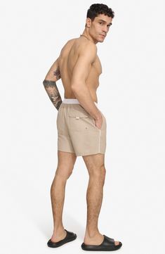 Soak up the sun in these recycled-fiber swim trunks built with quick-drying properties and UPF 40+ sun protection. 5" inseam (size Medium) Elastic/drawstring waist Front slant pockets; back patch pocket Lined 100% REPREVE polyester REPREVE recycled polyester is made from 100% post-consumer recycled plastic bottles Machine wash, tumble dry Imported Relaxed Fit Swimwear With Functional Drawstring For Beach, Summer Beach Swim Trunks With Functional Drawstring, Summer Nylon Swim Trunks With Drawstring, White Summer Swimwear For Outdoor, White Summer Outdoor Swimwear, White Swim Trunks For Beachwear, Summer Cotton Swim Trunks With Upf 50+, White Beachwear Swim Trunks For Outdoor, Nylon Swim Trunks With Drawstring For Vacation