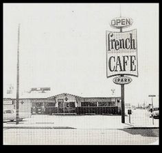 black and white photograph of french cafe sign