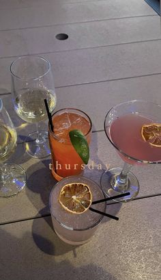 three different types of drinks on a table