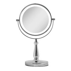 a round mirror sitting on top of a metal stand