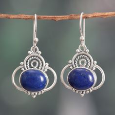 The classic elegance of the Indian region bathes these sublime dangle earrings crafted by local artisans and presented by Neeru Goel. Made as an homage to India's jewelry arts, these sterling silver pieces showcase intricate and dapper details decorating the enchanting beauty of lapis lazuli cabochons—symbols of truth and intellect. Traditional Sterling Silver Cabochon Earrings, Lapis Lazuli Jewelry, Lapis Lazuli Earrings, Turquoise Earrings Dangle, Traditional Earrings, Garnet Bracelet, India Jewelry, Earring Crafts, Local Artisans