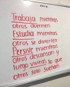 a white board with writing on it in spanish and english language, along with other words