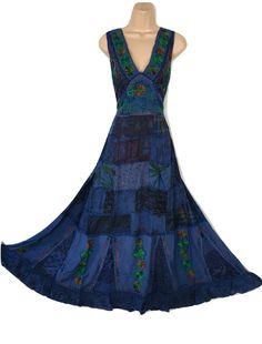 a blue dress on a mannequin dummy with an open back and colorful patchwork