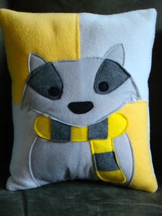 a pillow with a raccoon on it