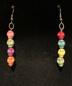 Multicolored skull dangle earrings Multicolor Bohemian Skull Jewelry, Multicolor Skull Jewelry For Day Of The Dead, Day Of The Dead Multicolor Skull Jewelry, Adjustable Skull-shaped Earrings With Ear Wire, Adjustable Skull Shaped Earrings With Ear Wire, Rainbow Beaded Earrings, Diy Pom Pom Rug, Rainbow Skull, Diy Earrings Easy