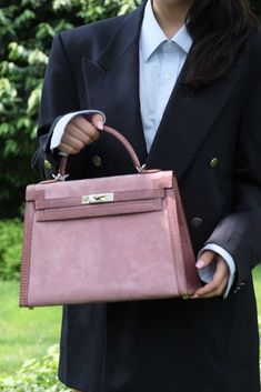 Rare doesn't even come close to describing this bag. A one-of-a-kind 32cm Sellier Kelly, this special order piece goes beyond what many believe possible from Hermès. Crafted in 2012 at the special request of a top-tier client, this bag features a soft pink body done in Rose Indienne Doblis Suede, framed by glossy Mauve Lizard forming the edges, handle, straps and clochette. Paired with Palladium hardware the effect is stunning, soft and full of color all at once, clearly and undeniably a standou High-end Pink Formal Bags, Elegant Pink Business Bag, Elegant Pink Business Bags, Pink Satchel For Business, Light Luxury Rectangular Satchel For Formal Occasions, Chic Pink Business Bag, Luxury Rectangular Bag With Hasp Closure, Formal Pink Bag With Hasp Closure, Elegant Pink Satchel For Formal Occasions