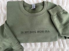 This in my dog mom era embroidered sweatshirt is the perfect Valentine's Day Gift for dog lovers.  The sweatshirt is preshrunk and is 50% cotton/50% polyester with a fleece lining on the inside making it oh so very soft and comfy!  To order: Simply select the color and size you would like, then type what you would like the sweatshirt to say in the personalization box. Please keep in mind that the longer the phrase is, the smaller the font will be. I am happy to help by giving suggestions or sending over previews if you are having trouble deciding.  *COLORS MAY VARY SLIGHTLY due to monitor coloring. Model is wearing a size XL and usually wears a Medium.  Tip:  Order a size up or 2 for an oversized look. Please feel free to message with any questions or personalization requests! I am more th Dog Mom Era, Dog Mom Sweater, Embroidered Products, Dog Lover Sweatshirt, Mom Crewneck, Lover Sweatshirt, Mom Era