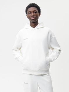 THIS HOODIE IS MADE WITH 320 GSM MIDWEIGHT COTTON AND IS TREATED WITH PPRMNT™ FOR ANTI-ODOR PROPERTIES, HELPING KEEP YOUR HOODIE FRESHER FOR LONGER. DESIGNED TO BE WORN YEAR-ROUND, THE FABRIC OFFERS A SOFT FEEL THAT’S PERFECT FOR ALL SEASONS.THIS GENDERLESS HOODIE IS IDEAL FOR EVERYDAY COMFORT AND VERSATILITY. Basic White Cotton Hoodie, Fitted White Cotton Hoodie, Playful White Cotton Hoodie, White Cotton Hoodie With Branding Details, White Functional Moisture-wicking Hoodie, Designer Hoodies, Eco Clothing, Mens Cashmere, Active Wear Pants