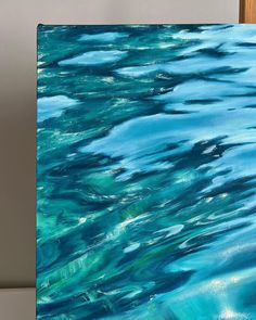 an acrylic painting of blue and green water