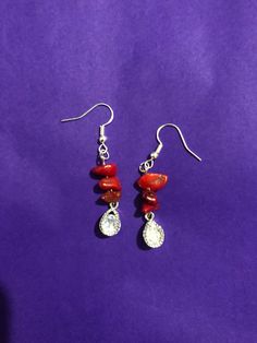 Red coral gem earrings, made with silver plated hooks and cubic zirconia charms. Crystal Dangle Jewelry With Stones, Red Teardrop Natural Stone Jewelry, Red Sterling Silver Dangle Crystal Earrings, Red Nickel-free Drop Crystal Earrings, Red Crystal Dangle Jewelry, Silver Drop Earrings With Stones, Red Crystal Earrings For Gift, Red Crystal Drop Earrings, Silver Crystal Earrings With Stones