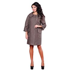 This youth coat features a straight silhouette and is crafted from semi-wool Italian fabric. Key details include: Lining: Nylon. Sleeve Length: ¾ sleeves, 63 cm measured from the neckline. Collar: Notched flat-laying collar. Pockets: Patch pockets with flaps. Decorative Details: Cuff ends are adorned with decorative gemstone brooches. Closure: Central closure with five sewn-on buttons. Back Details: A free belt-tab stitched into the side seams at the back. Back Length: 88-91 cm. Fabric Composition: 50% wool, 30% polyester, 20% viscose. This coat is a stylish, youthful option that combines a modern silhouette with decorative accents for a fresh look.