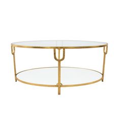 an oval glass coffee table with gold metal frame