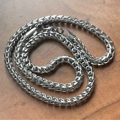 This Is Such A Great Staple Everyday Mens Chain/ Necklace. The Pattern Is A Combination Of A Celtic/Wheat Weaved Chain Held Into A Box Link Structure. It’s Incredibly Unique. It Could Be Worn On Its Own Or With A Pendant. And It Would Look Incredible Layered. This Is Stainless Steel And Has A Lobster Claw Closure. Every Strand Of Stainless Steel Used To Create This Pattern Is Solid. The Necklace Is Incredibly Sturdy And Can Withstand A Ton Of Wear And Tear. It’s Much Stronger Than Sterling, And Doesn’t Ding As Easily. Around 23.5 Inches (We Can Size Down For An Additional Fee). Luxury Silver Wheat Chain Necklace, Silver Metal Chain Necklace With Wheat Chain, Chain Ideas, Mens Chain, Mens Chain Necklace, Mens Accessories Jewelry, Chains For Men, Silver Man, Steel Chain