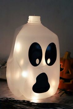 a lighted ghost head sitting on top of a table