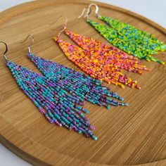 Add a playful touch to your summer style with our Summer Vibes Fringe Earrings! These zesty lime green earrings feature a fun beaded fringe, perfect for adding a pop of color to any outfit. Get ready to rock some serious summer vibes! Trendy Summer Tassel Dangle Earrings, Trendy Dangle Tassel Earrings For Summer, Green Tassel Beach Earrings, Beach Green Tassel Earrings, Trendy Summer Jewelry With Tassels, Summer Beach Tassel Earrings With Dangling Beads, Spring Beach Earrings With Fringe, Dangle Beaded Earrings For Summer Parties, Bohemian Beaded Earrings For Summer Parties