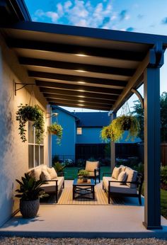 an outdoor living area with furniture and plants