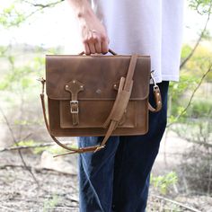 Introducing our newest addition to the shop, the Leather Messenger Bag - a timeless creation crafted from premium leather, exuding sophistication and mystery. With a sleek design, hand-stitched details, and curated hardware, it effortlessly elevates your style. Stay organized with its roomy interior and multiple pockets. Turn heads as you make a statement with this work of art by your side. Fits up to 13" laptops Authentic American Full Grain Leather Silver hardware, including buckles, rivets, a Timeless Leather Satchel With Palladium Hardware, Classic Leather Shoulder Bag With Palladium Hardware, Brown Leather Top Handle Satchel, Timeless Leather-lined Satchel Shoulder Bag, Classic Brown Flap Bag With Palladium Hardware, Everyday Bags With Bridle Leather And Leather Handles, Classic Oiled Leather Shoulder Bag, Brown Bridle Leather Bags With Leather Handles, Classic Leather Backpack With Vegetable Tanned Leather