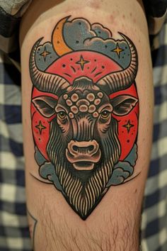 a man with a tattoo on his arm has a bull head and stars in the background