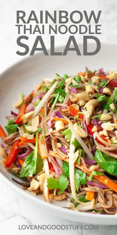 a white plate topped with noodles and veggies