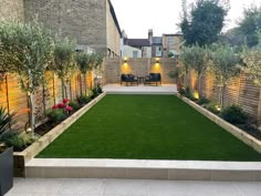 a backyard with artificial grass and seating area