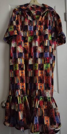 "Vintage women's shift maxi dress, multi colored Polynesian styled muu muu. I did see a dress that looked very similar that was called a Reba Dress in Madras.  Could not find any tags may be hand made. Measurements are as follows: Chest seam to seam from under arms 30\" x 2 = 60\" Across shoulders seam to seam 19\" Back collar to bottom hem 46\" Hips free with side pockets and ruffles bottom. In excellent condition." Pake Muu Dress, Muumuu Dress Vintage, Shift Maxi Dress, Multicolor Tropical Print V-neck Dress, Maxi Shift Dress, Multi Colored, Dress Clothes For Women, Ruffles, Vintage Ladies