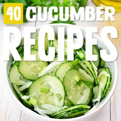 a white bowl filled with cucumber slices on top of a wooden table next to a