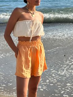 Expertly crafted from breezy cotton gauze, our Seashell Tube Top features a stretchy elastic top and bottom for a secure fit. The versatile tie-top design adds charming detail and a gathered effect. Perfect for beach days and warm weather, this top pairs perfectly with the Capri Linen Shorts Elastic Top, Top Design, Tie Top, Linen Shorts, Beach Days, Tube Top, Beach Day, Warm Weather, Sea Shells