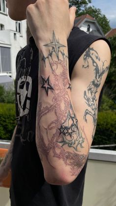 a man with a tattoo on his arm